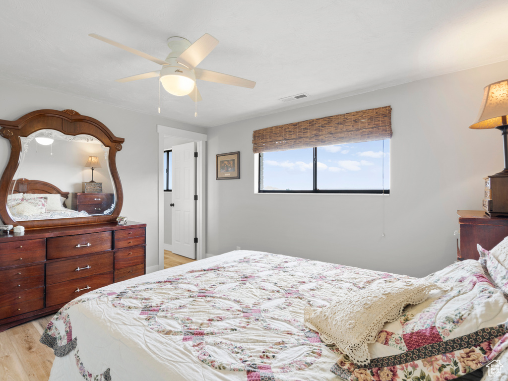 Bedroom featuring light wood-style flooring and a ceiling fan