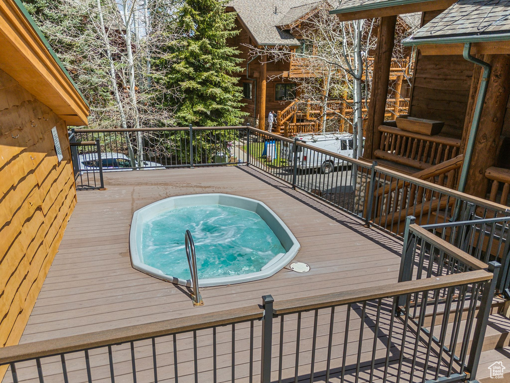 View of pool with a wooden deck