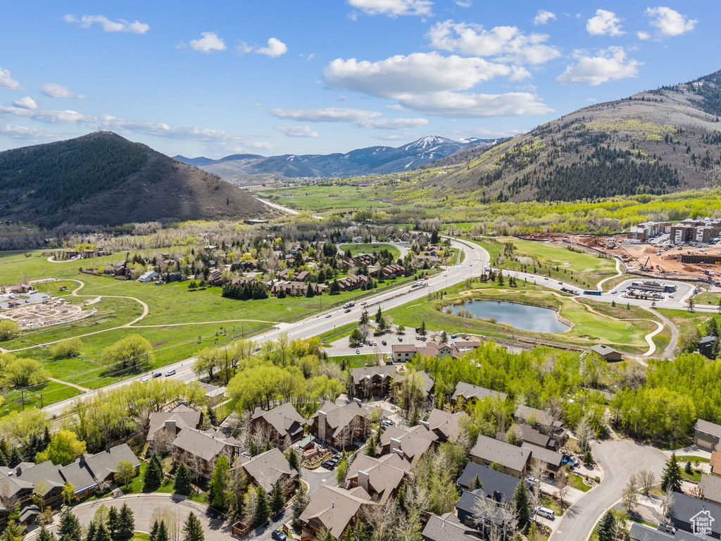 Aerial perspective of suburban area with a water and mountain view