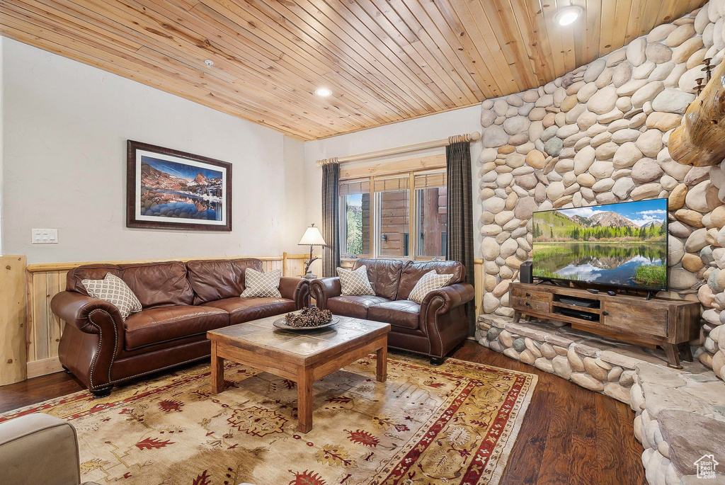 Living area with wooden ceiling, wainscoting, wood finished floors, and recessed lighting