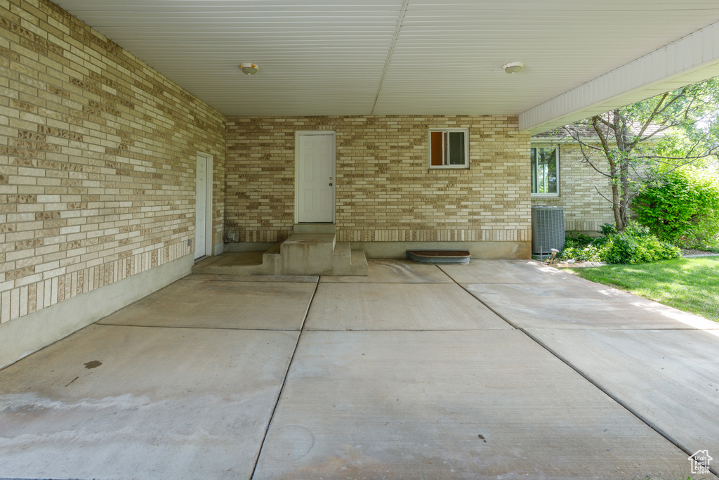 View of patio / terrace with an attached carport and central air condition unit