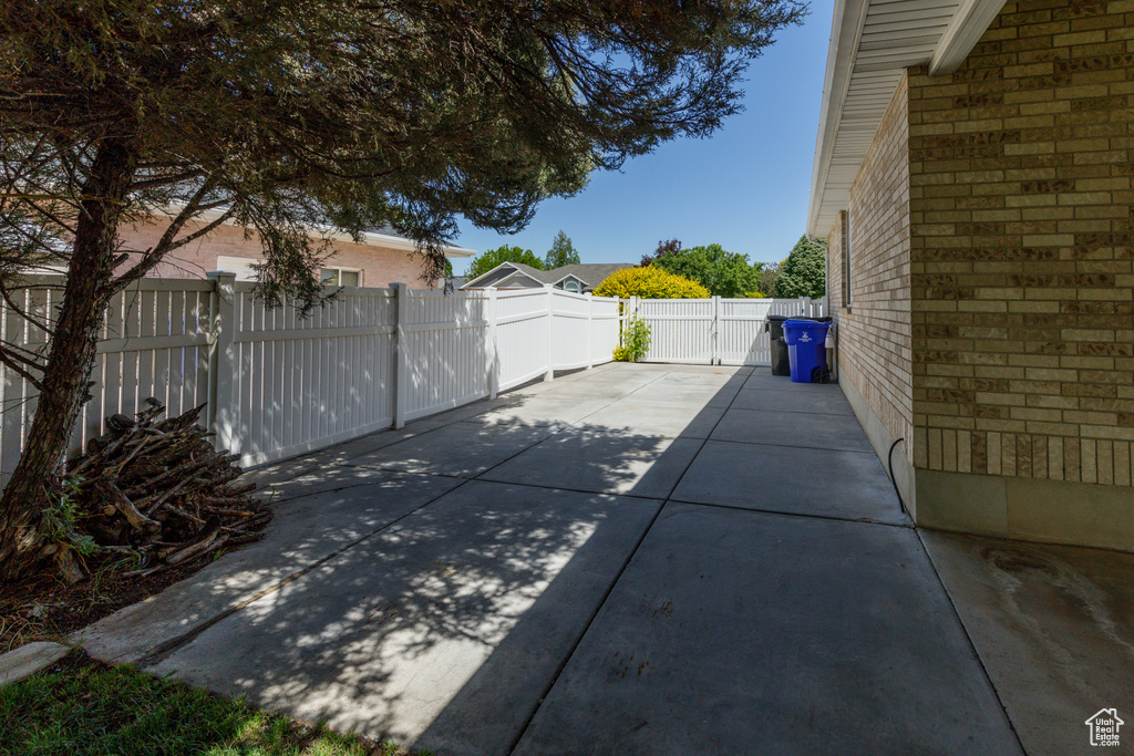 Fenced backyard featuring a patio