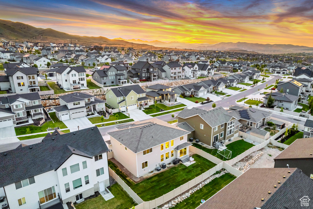 Aerial view at dusk of a residential view and a mountain view