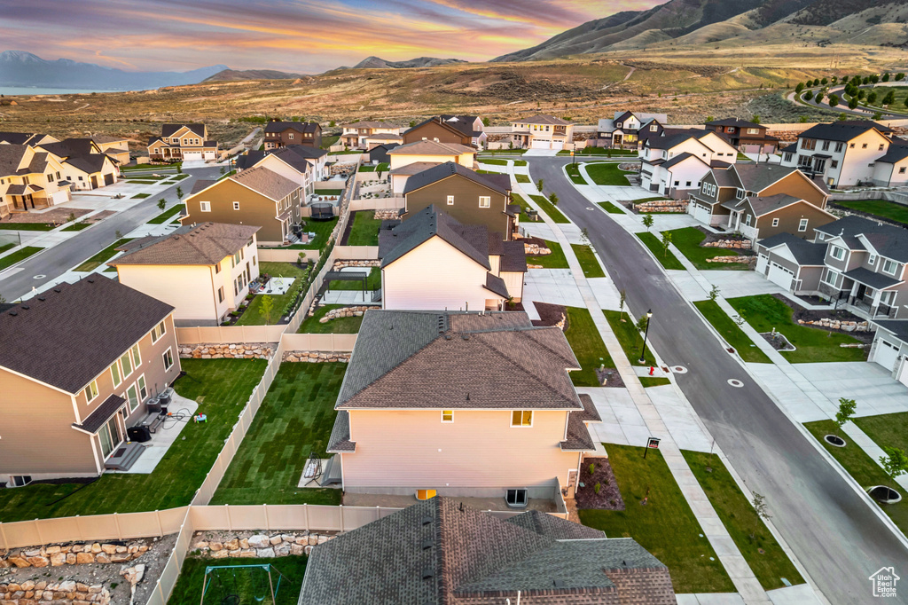 Aerial view at dusk of a residential view and a mountain view
