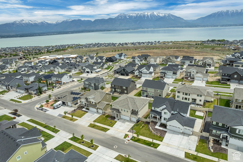 Aerial perspective of suburban area featuring a water and mountain view