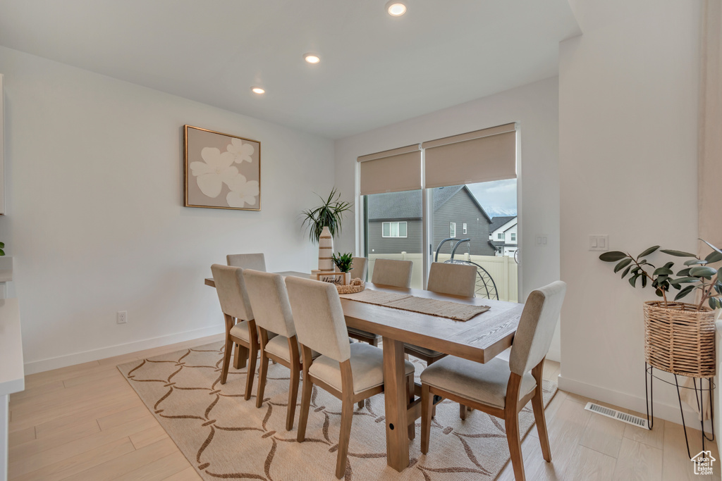 Dining space with recessed lighting, baseboards, and light wood-style floors