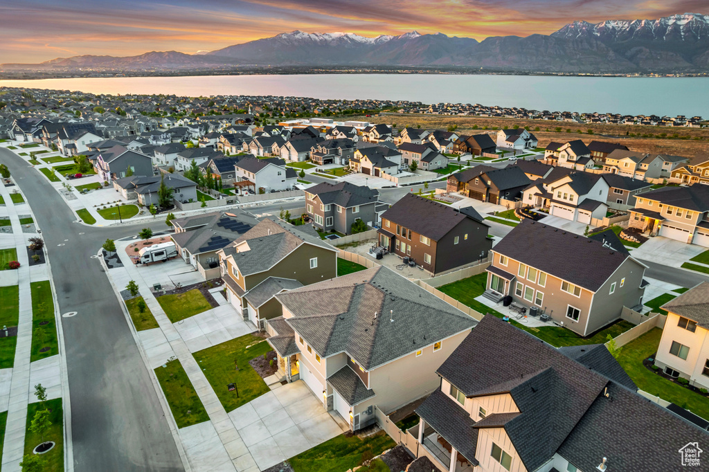 Aerial view at dusk of a water and mountain view and a residential view