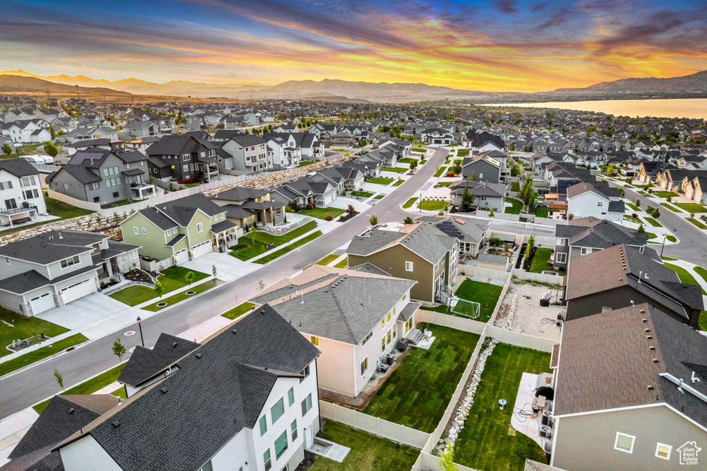 Aerial view at dusk of a residential view and a mountain view