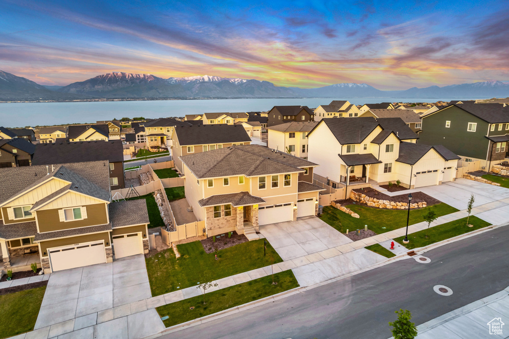 Aerial perspective of suburban area with a water and mountain view