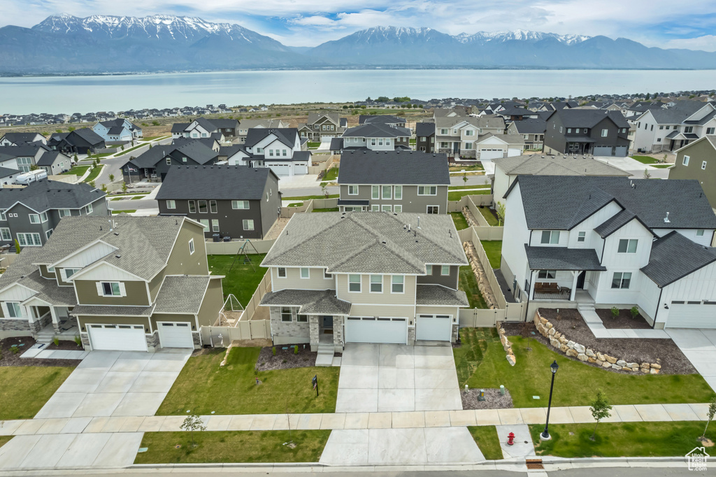 Aerial perspective of suburban area featuring a water and mountain view