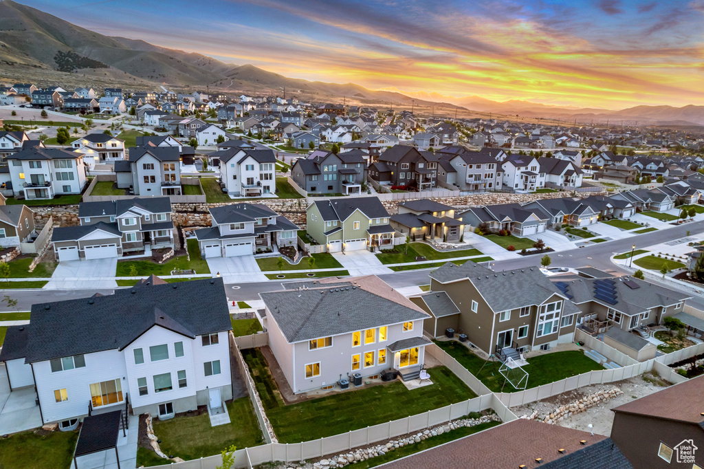 Aerial view at dusk of a residential view and a mountain view