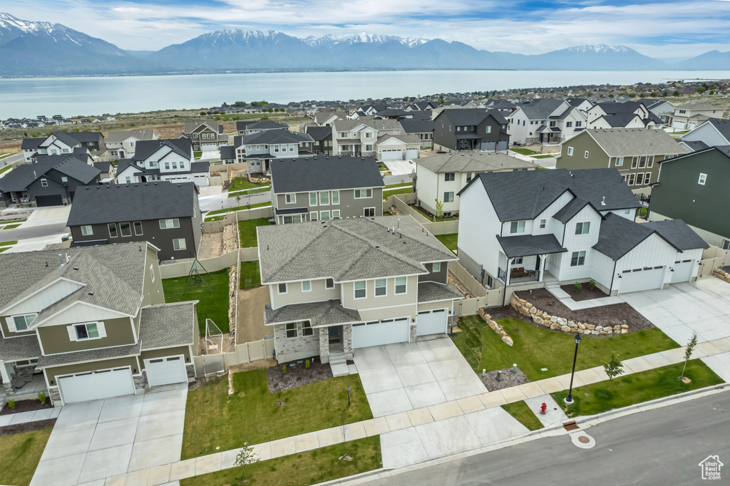 Aerial perspective of suburban area featuring a water and mountain view