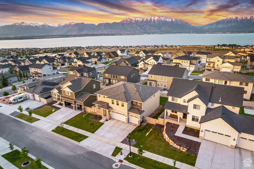 Aerial view at dusk of a water and mountain view and a residential view