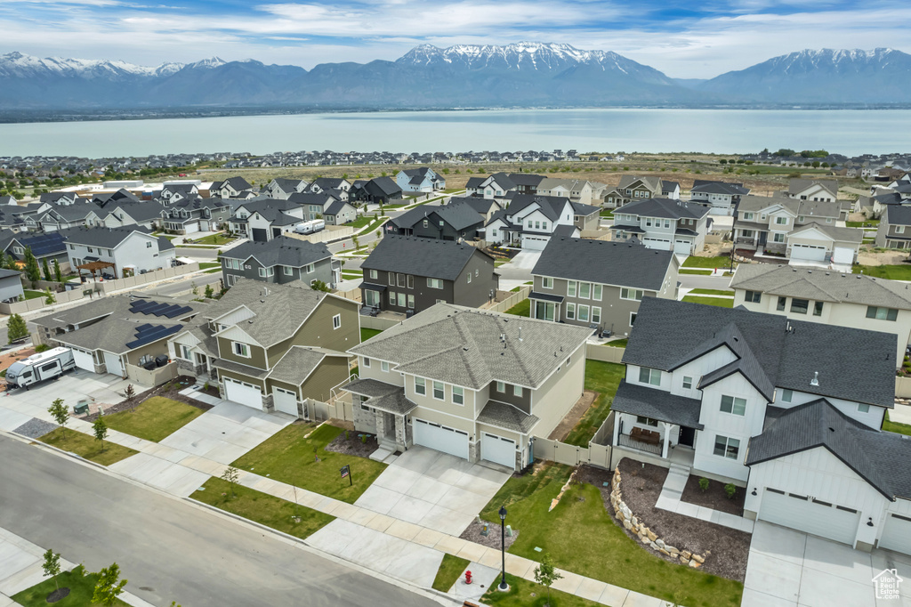 Aerial view of residential area featuring a water and mountain view