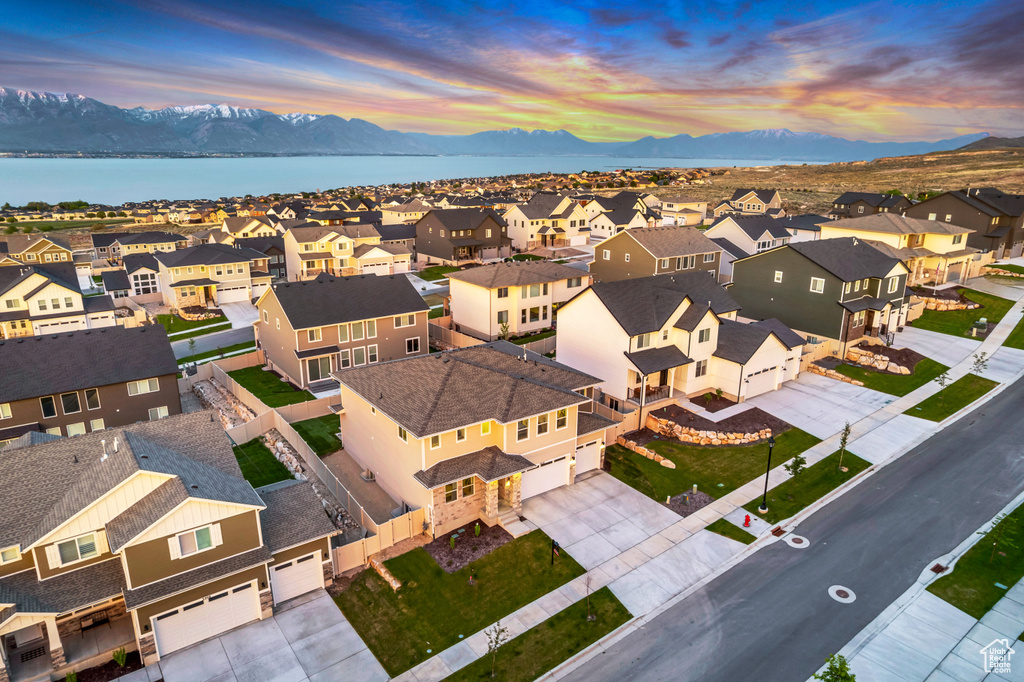 Aerial perspective of suburban area with a mountain backdrop