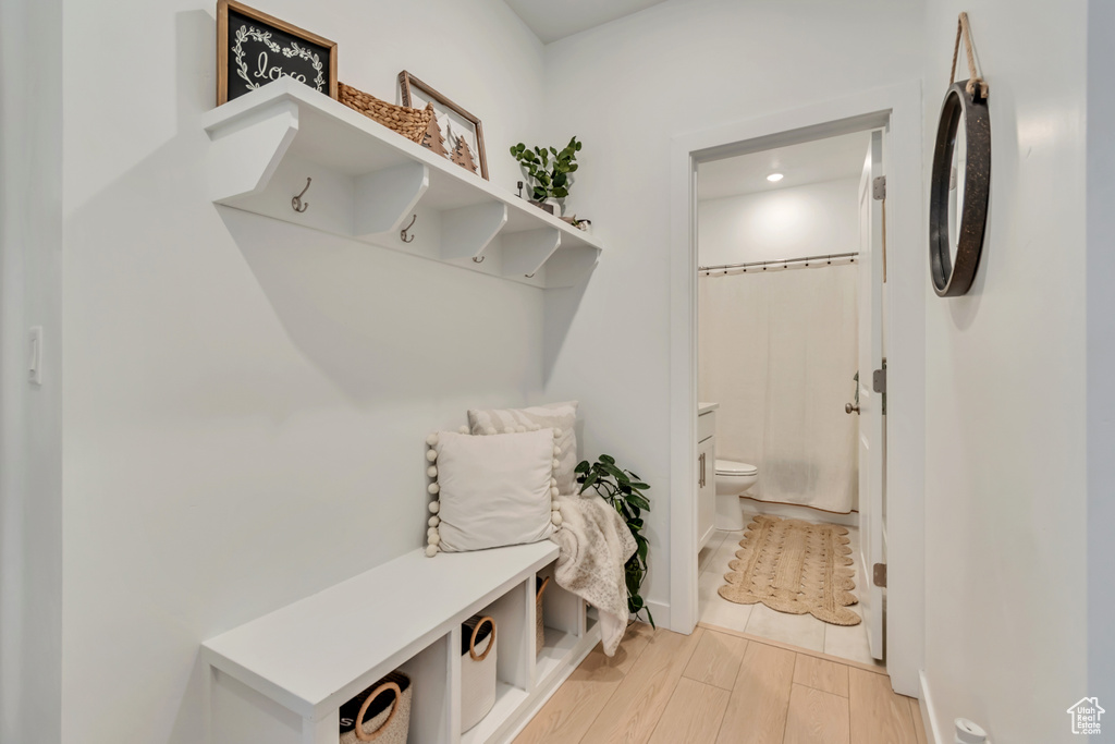 Mudroom featuring light wood finished floors and recessed lighting