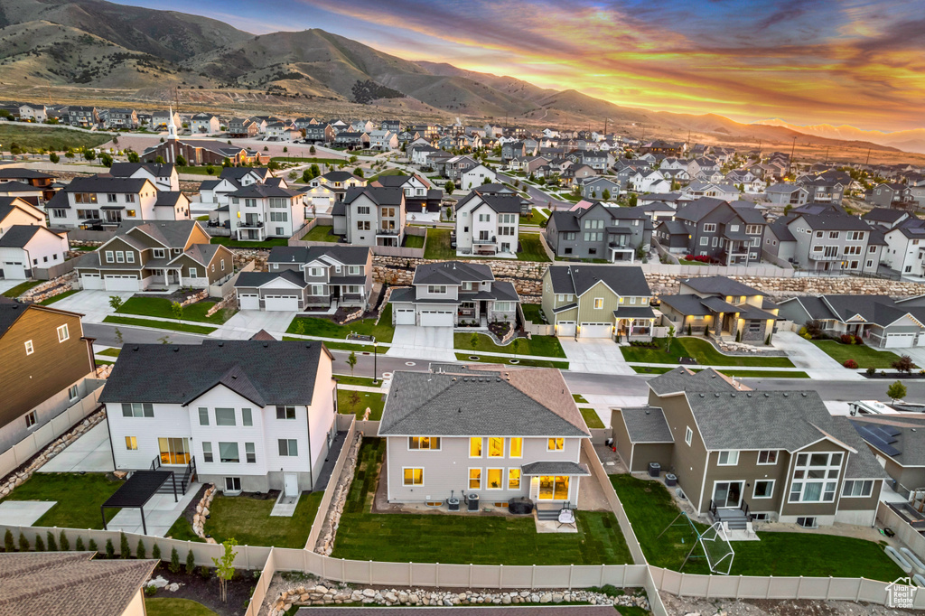Aerial perspective of suburban area with a mountain backdrop
