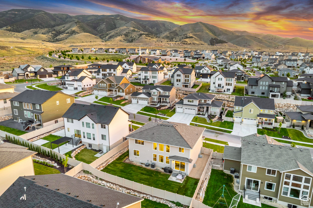 Aerial view at dusk of a residential view and a mountain view