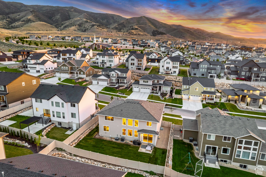 Aerial view of residential area featuring a mountain backdrop