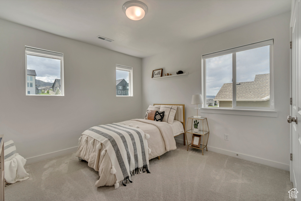 Bedroom with carpet flooring and baseboards