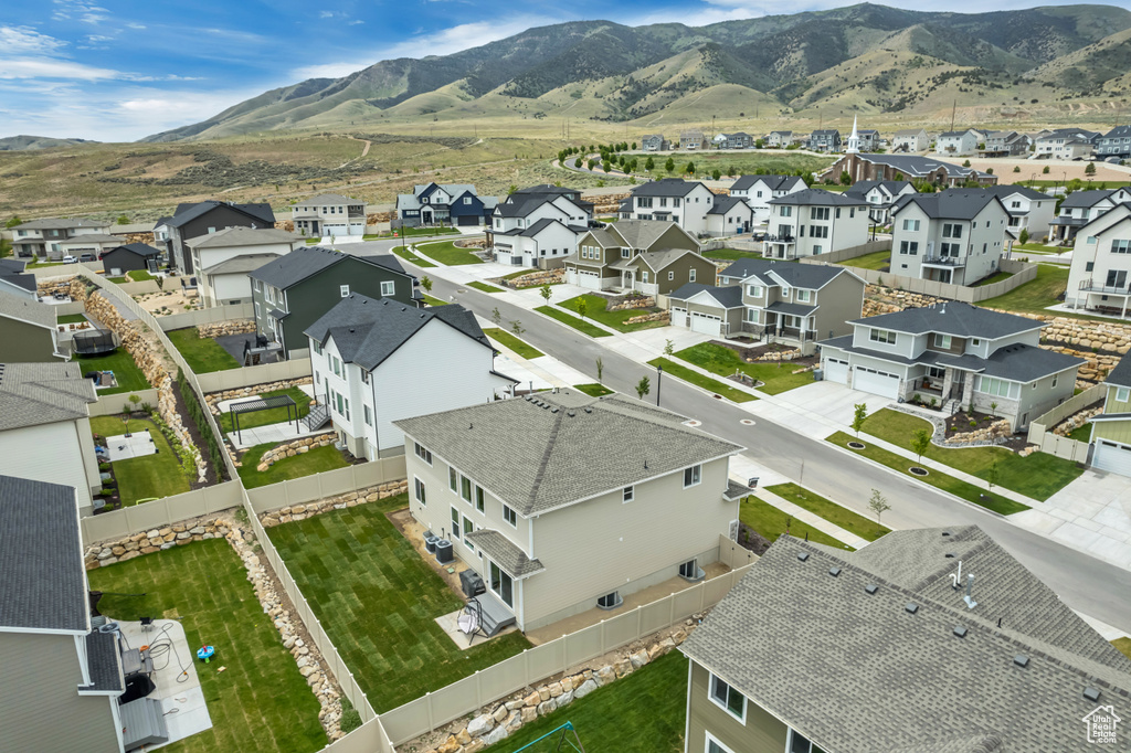 Aerial perspective of suburban area featuring a mountain backdrop