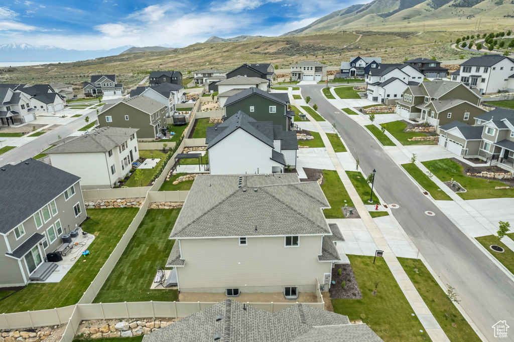 Aerial perspective of suburban area with a mountain backdrop