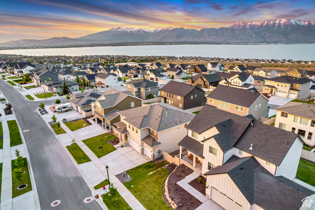Aerial view at dusk of a water and mountain view and a residential view