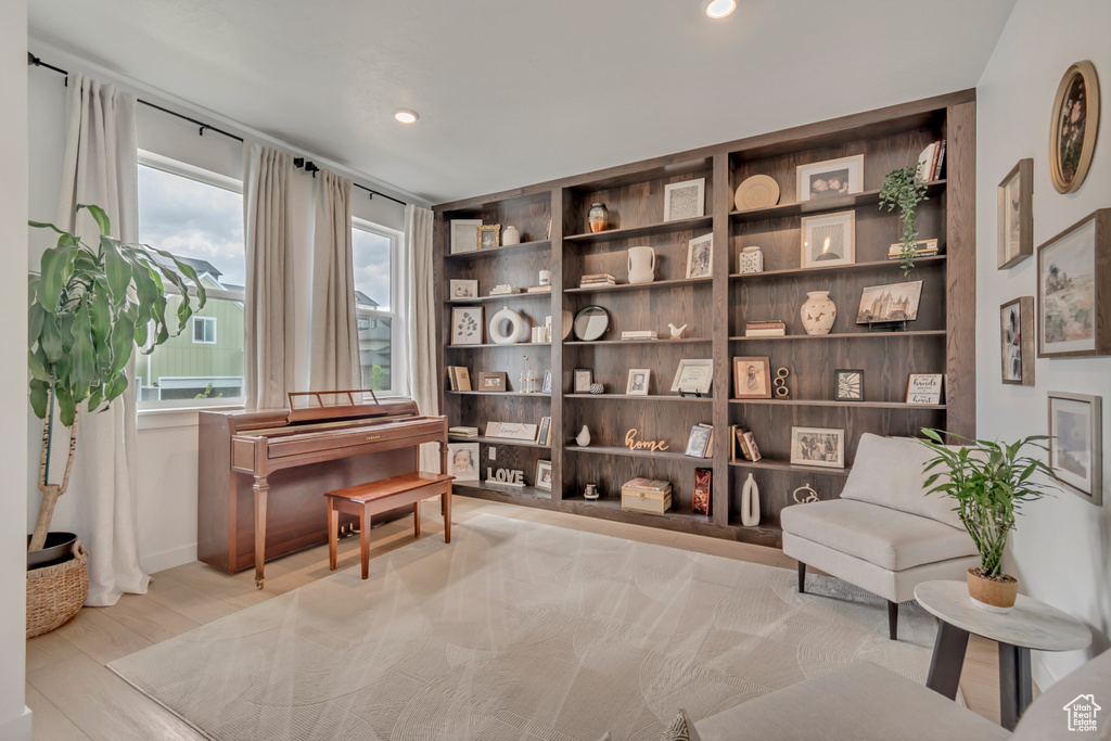 Sitting room featuring wood finished floors, recessed lighting, and baseboards