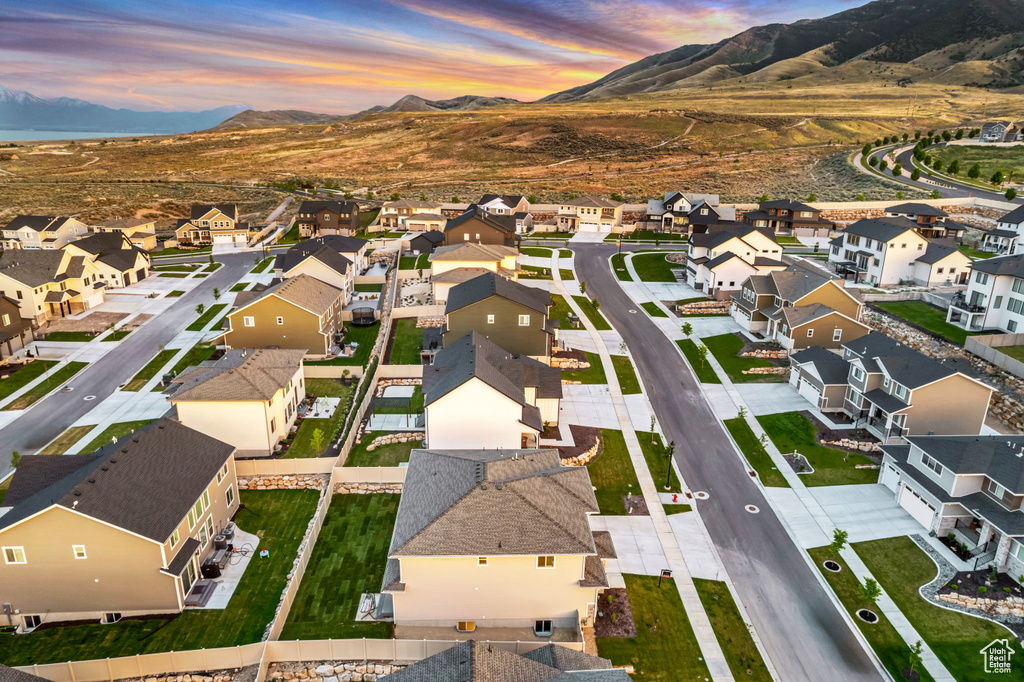 Aerial view of residential area featuring a mountain backdrop