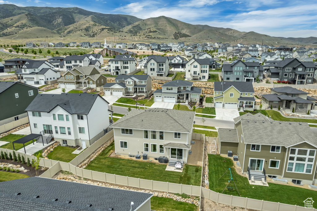 Aerial perspective of suburban area with a mountain backdrop
