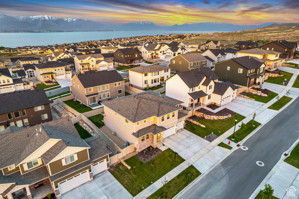 Aerial view at dusk of a residential view and a water and mountain view
