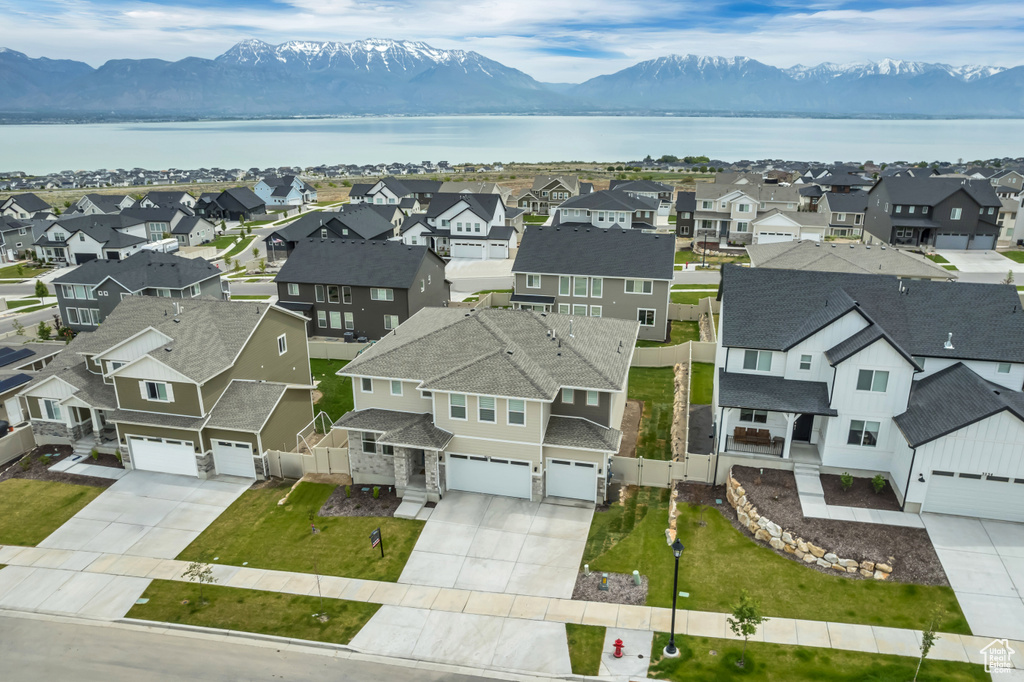 Aerial perspective of suburban area with a water and mountain view
