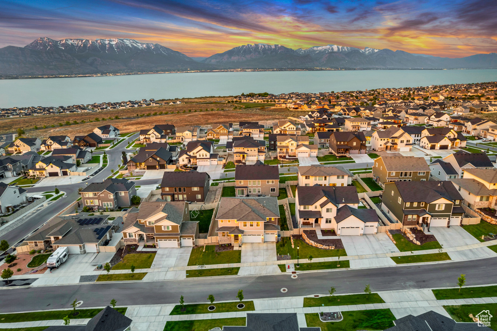 Aerial view of residential area featuring a water and mountain view