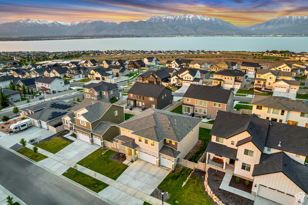 Aerial perspective of suburban area featuring a water and mountain view