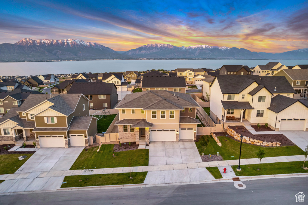Aerial perspective of suburban area with a water and mountain view