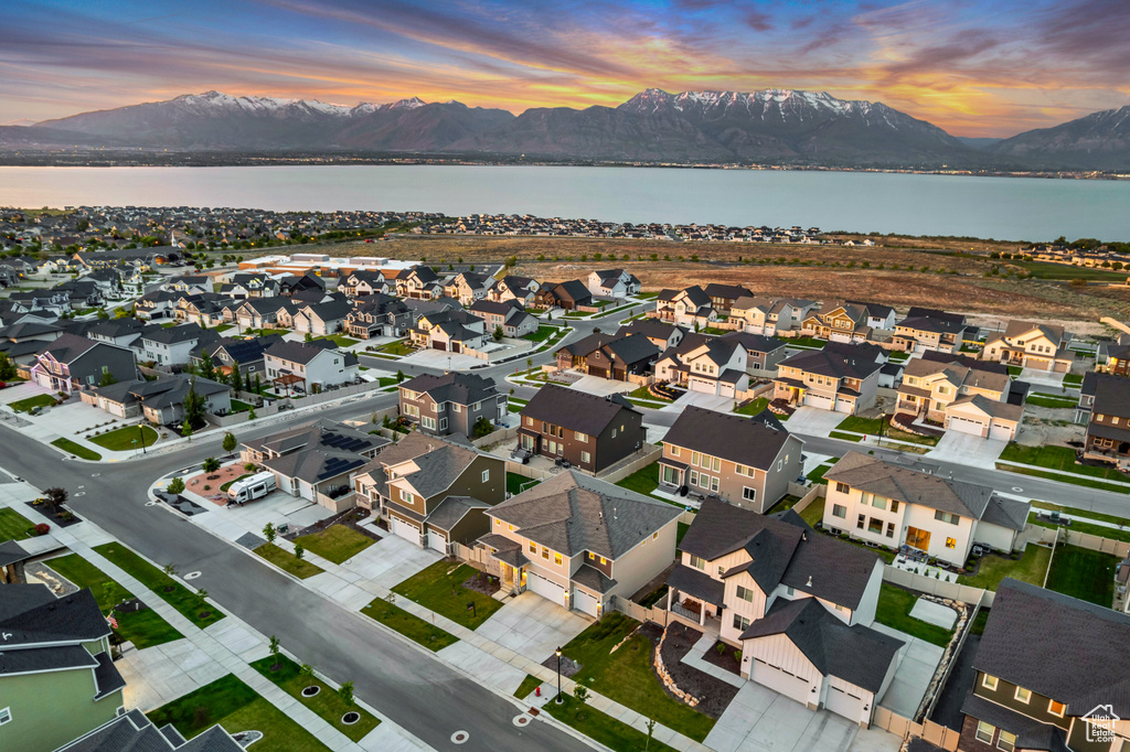 Aerial view at dusk of a water and mountain view and a residential view