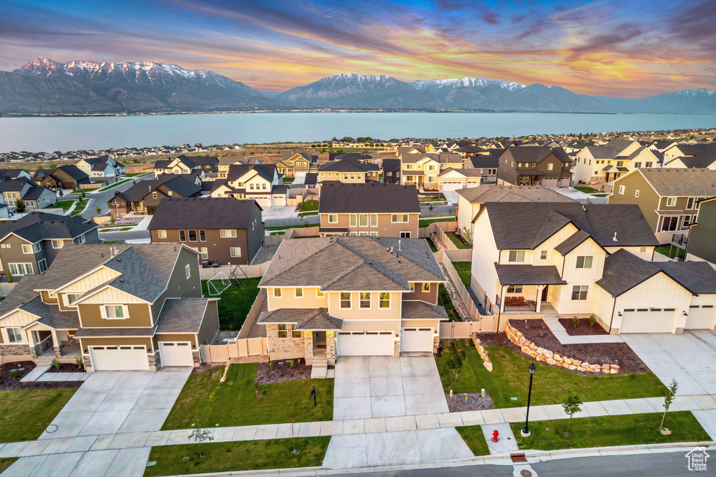 Aerial view at dusk of a residential view and a water and mountain view
