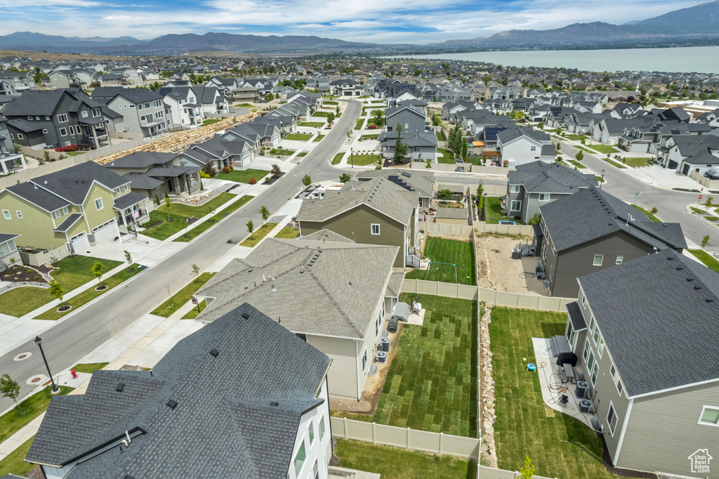 Aerial view of residential area featuring a water and mountain view