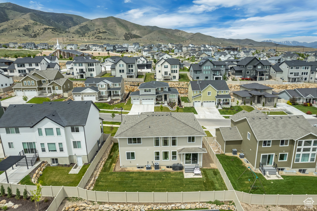 Aerial view of residential area with a mountainous background