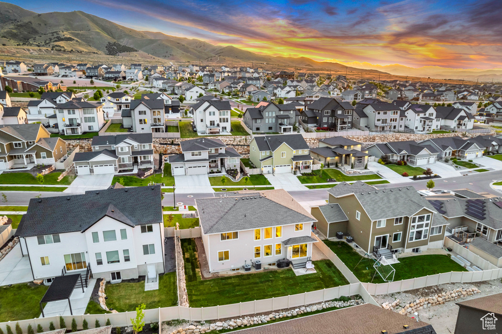 Aerial perspective of suburban area featuring a mountain backdrop