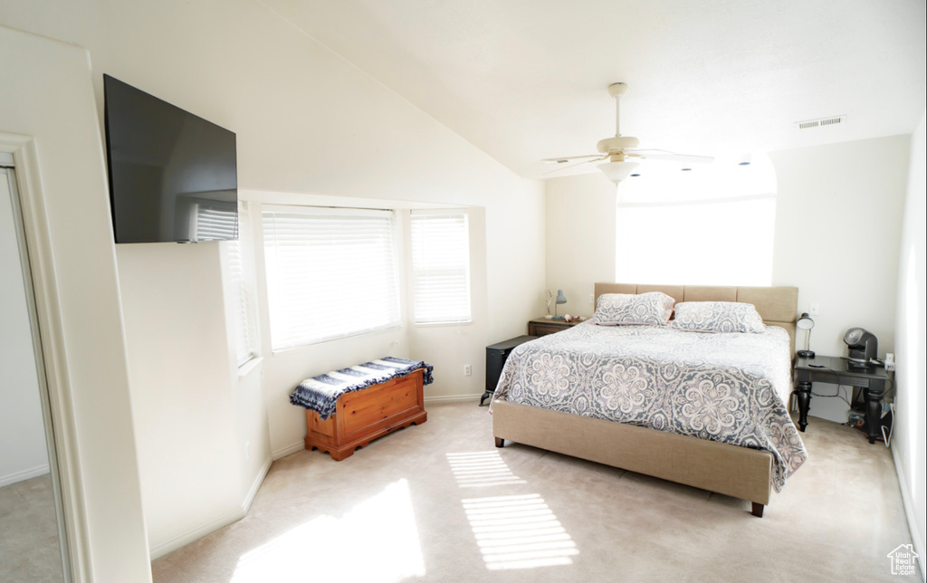 Bedroom featuring carpet floors, lofted ceiling, baseboards, and ceiling fan
