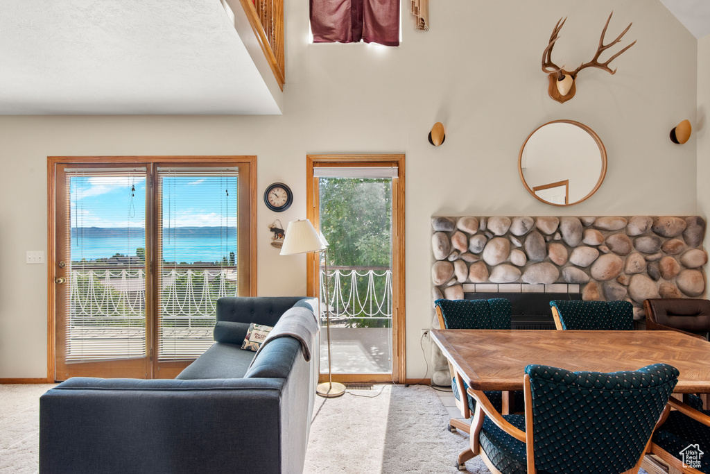 Carpeted living area with baseboards