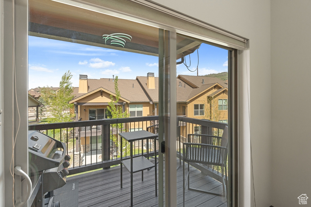 Balcony featuring a residential view and grilling area
