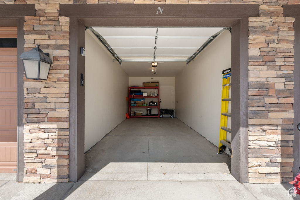 Garage featuring a garage door opener