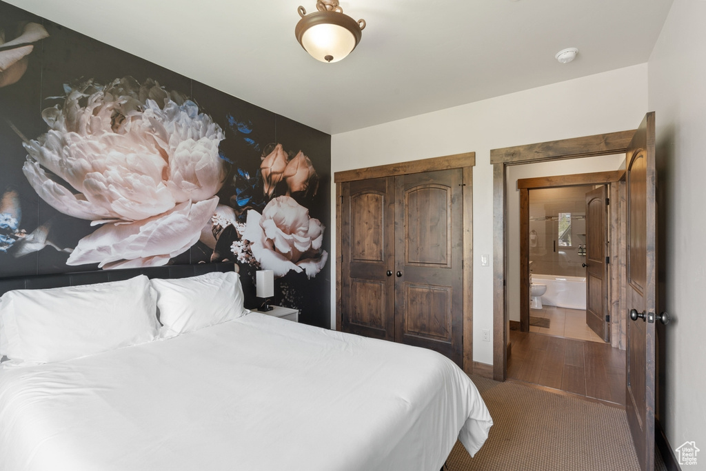 Carpeted bedroom with baseboards