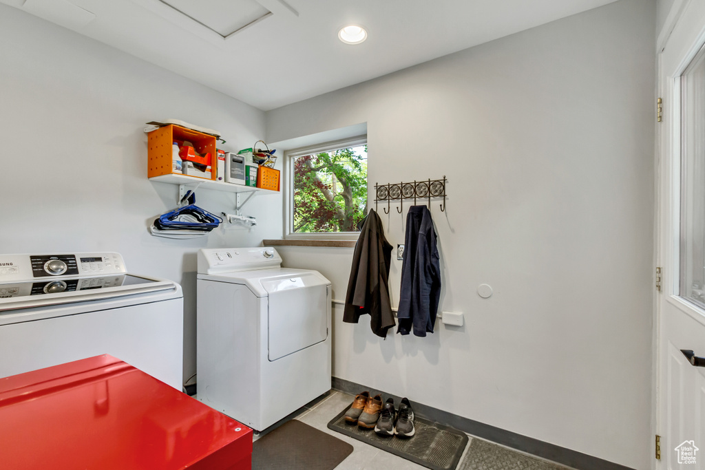 Laundry area with washing machine and dryer and recessed lighting