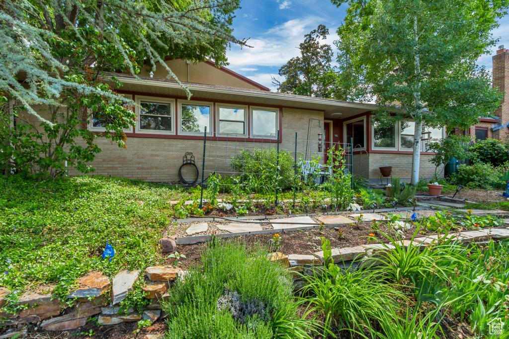 View of front of house featuring brick siding