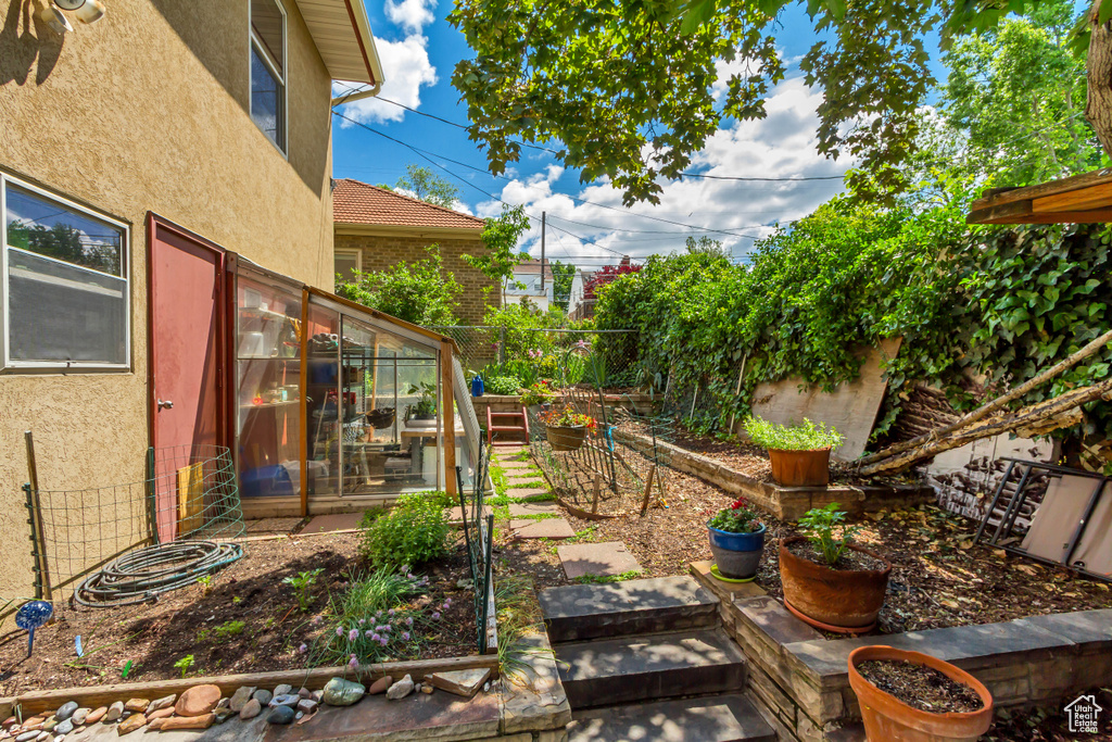 Fenced yard with a vegetable garden