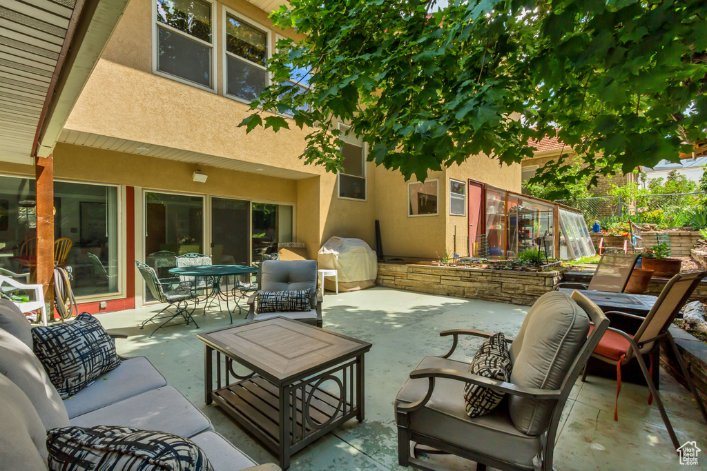 View of patio / terrace featuring outdoor lounge area, outdoor dining area, and a grill