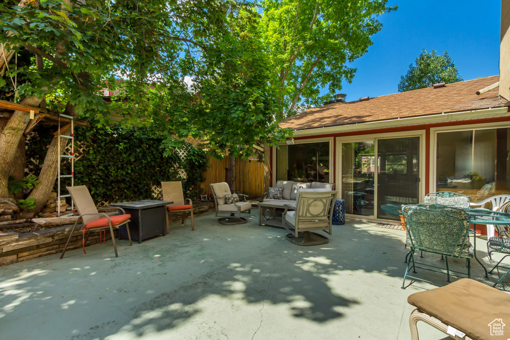 View of patio / terrace featuring an outdoor living space with a fire pit